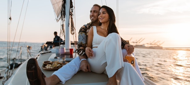 A couple enjoying a date with Jolly Sailing on Long Beach's waters.